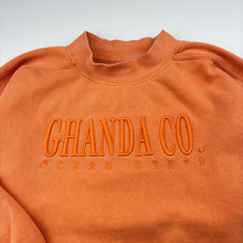 Load image into Gallery viewer, Unisex GHANDA, orange fleece lined sweater / jumper, wash fade, light marks, FUC, size 9-10,