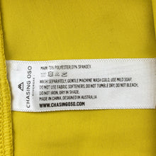 Load image into Gallery viewer, Girls CHASING OSO, yellow dance / gymnastics shorts, EUC, size 8,